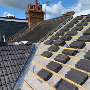 Black concrete re-roofing tiles in Bushey Hertfordshire.